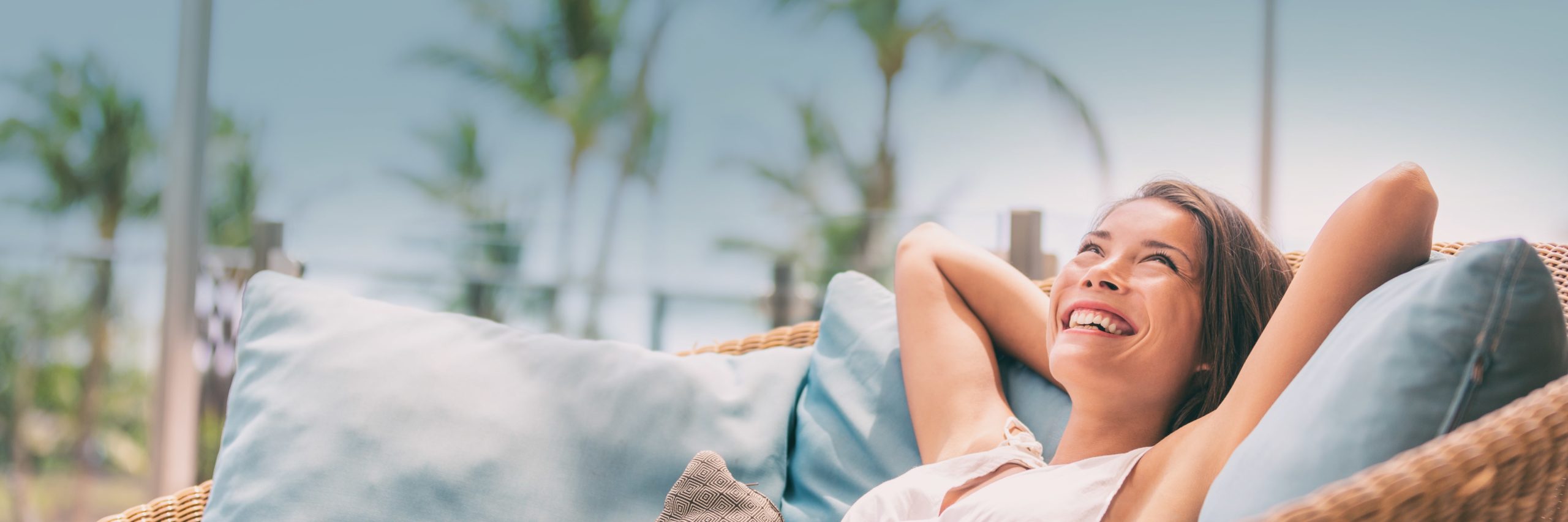 relaxed woman planning for retirement in a tropical destination