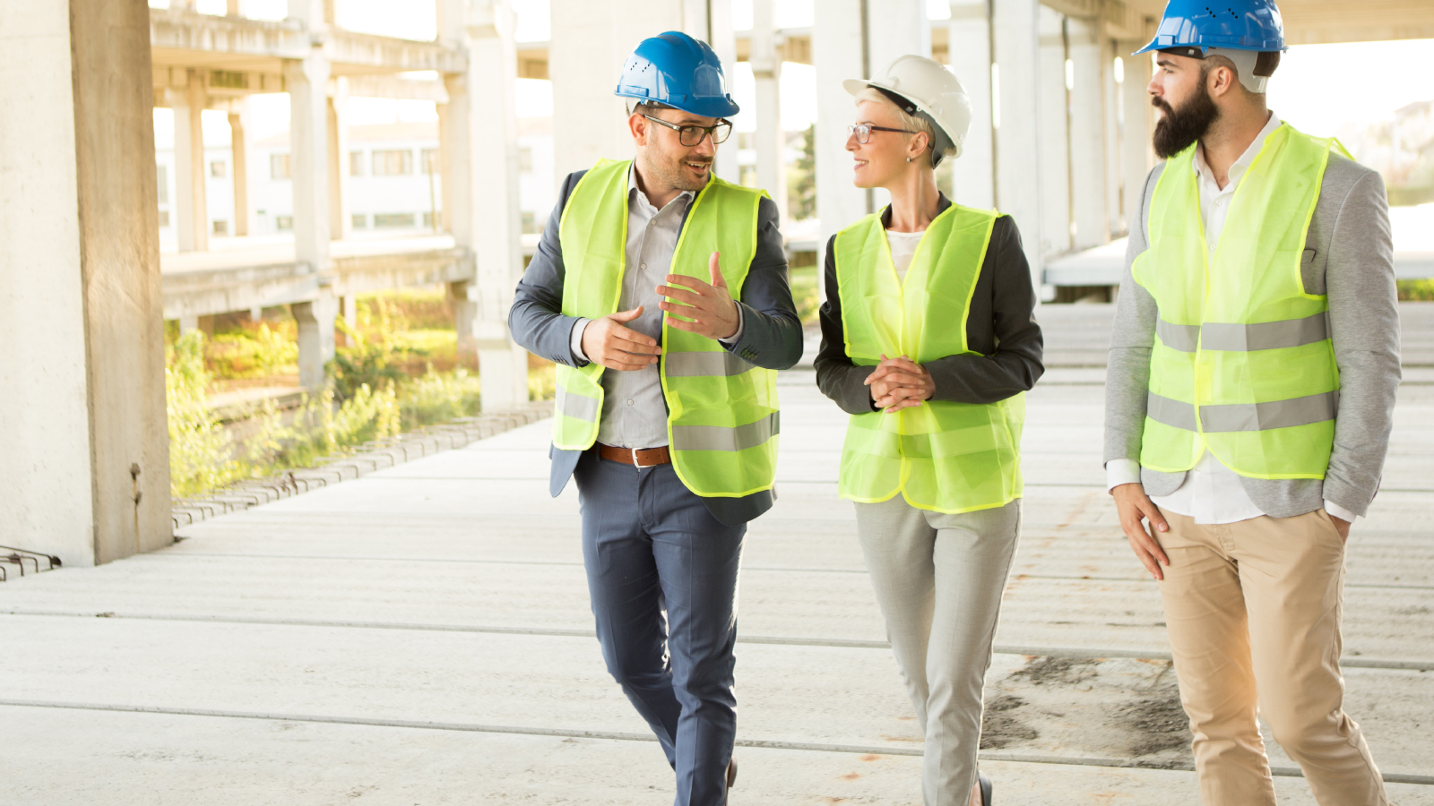 Business woman meets with Construction crew on site of construction build