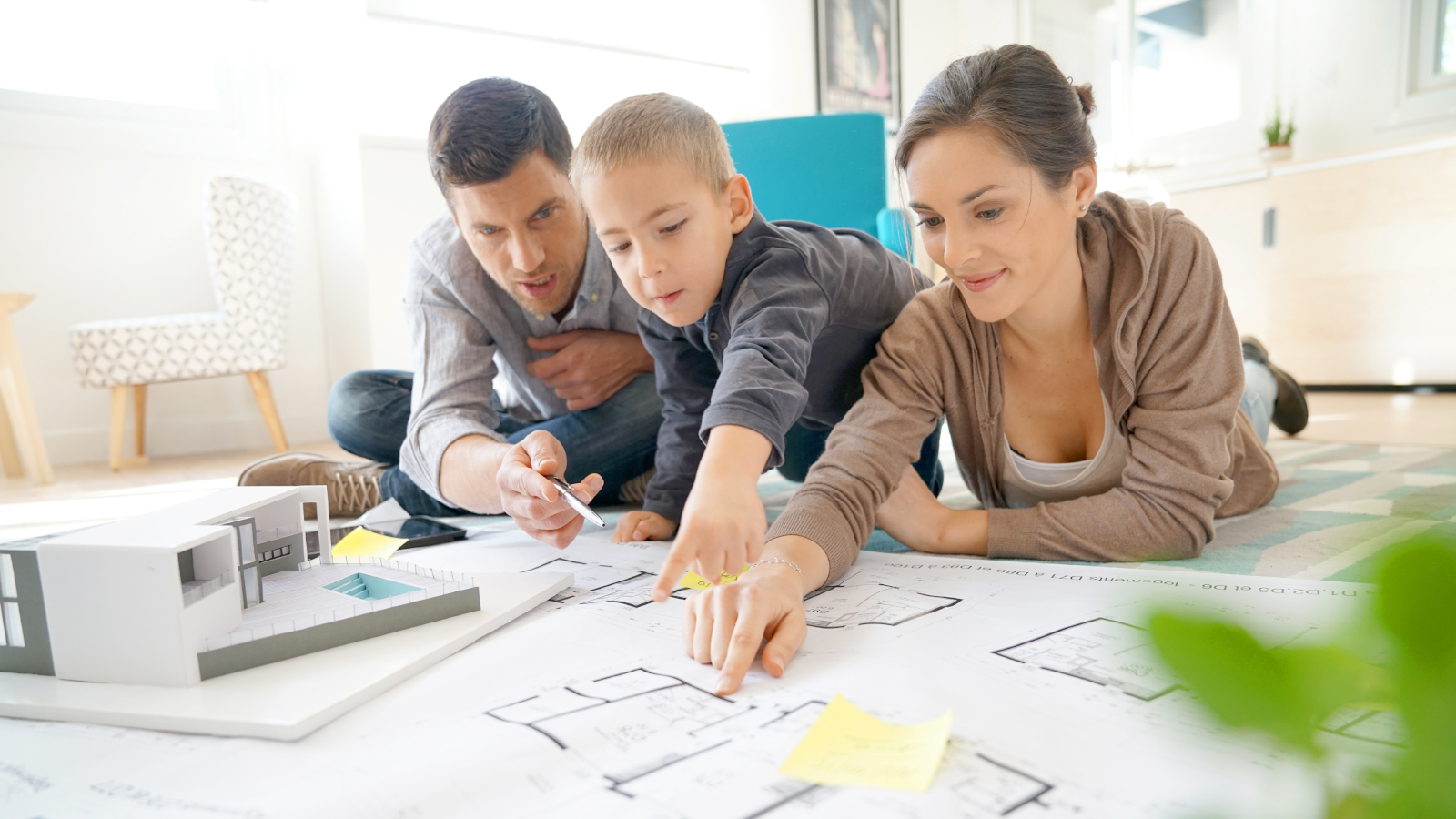 family looking at blueprints together