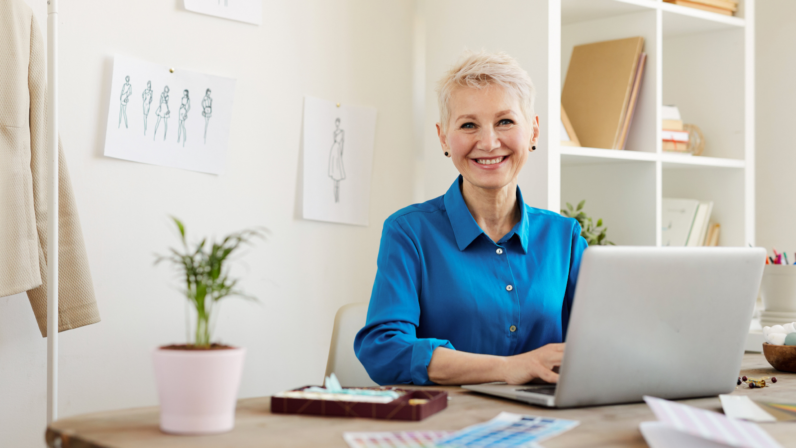 Woman working at desk on laptop