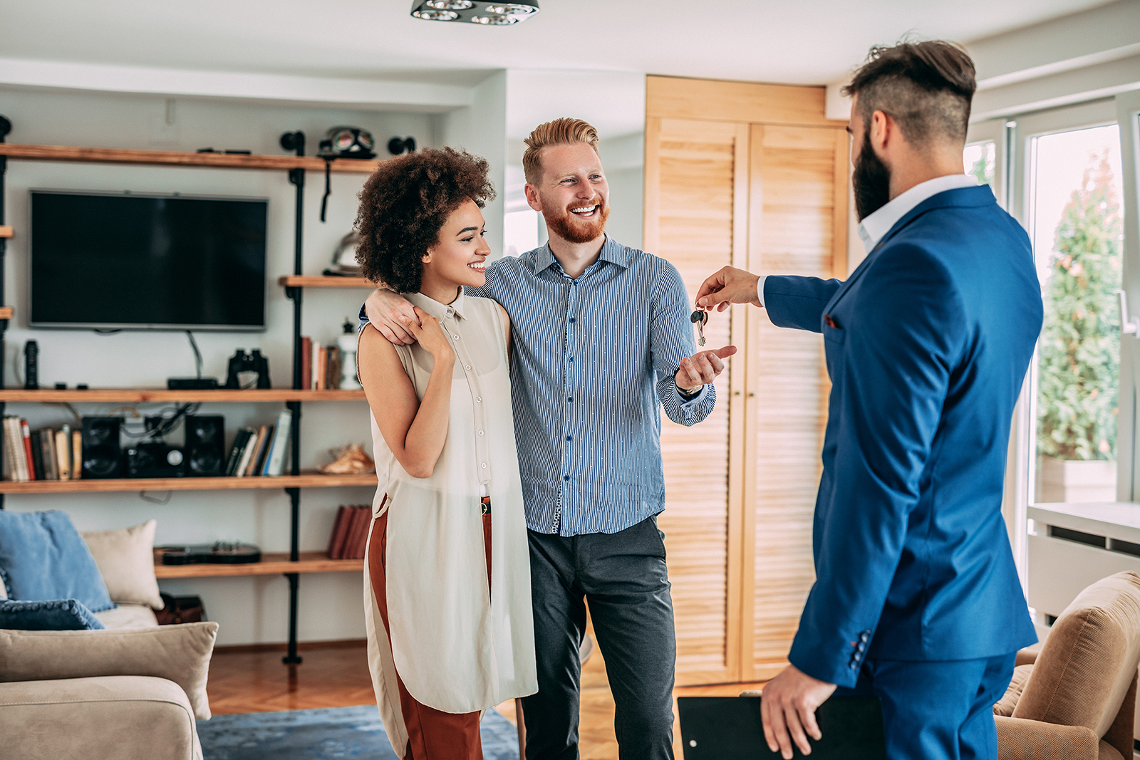 Couple getting keys to new home