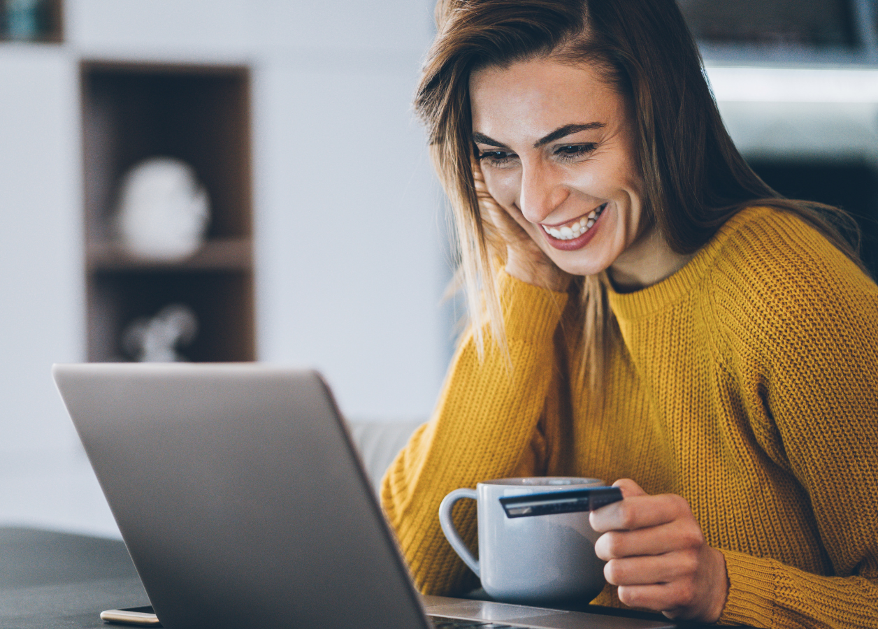 Woman shopping online with debit card