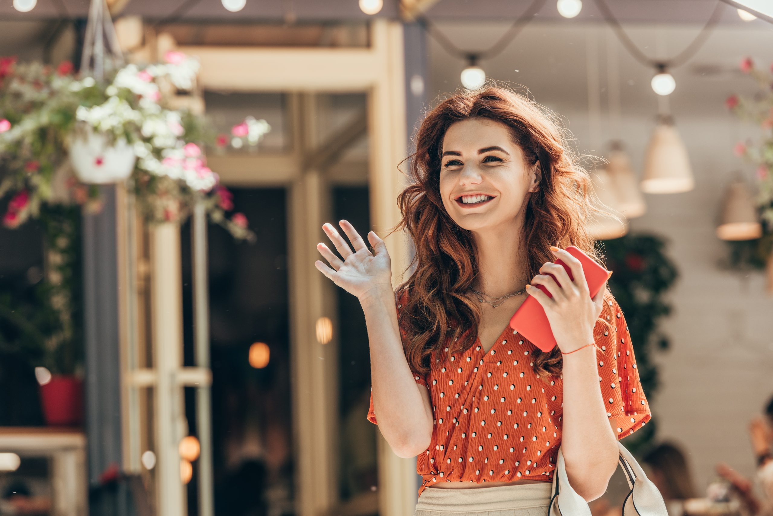 Cheerful woman waving