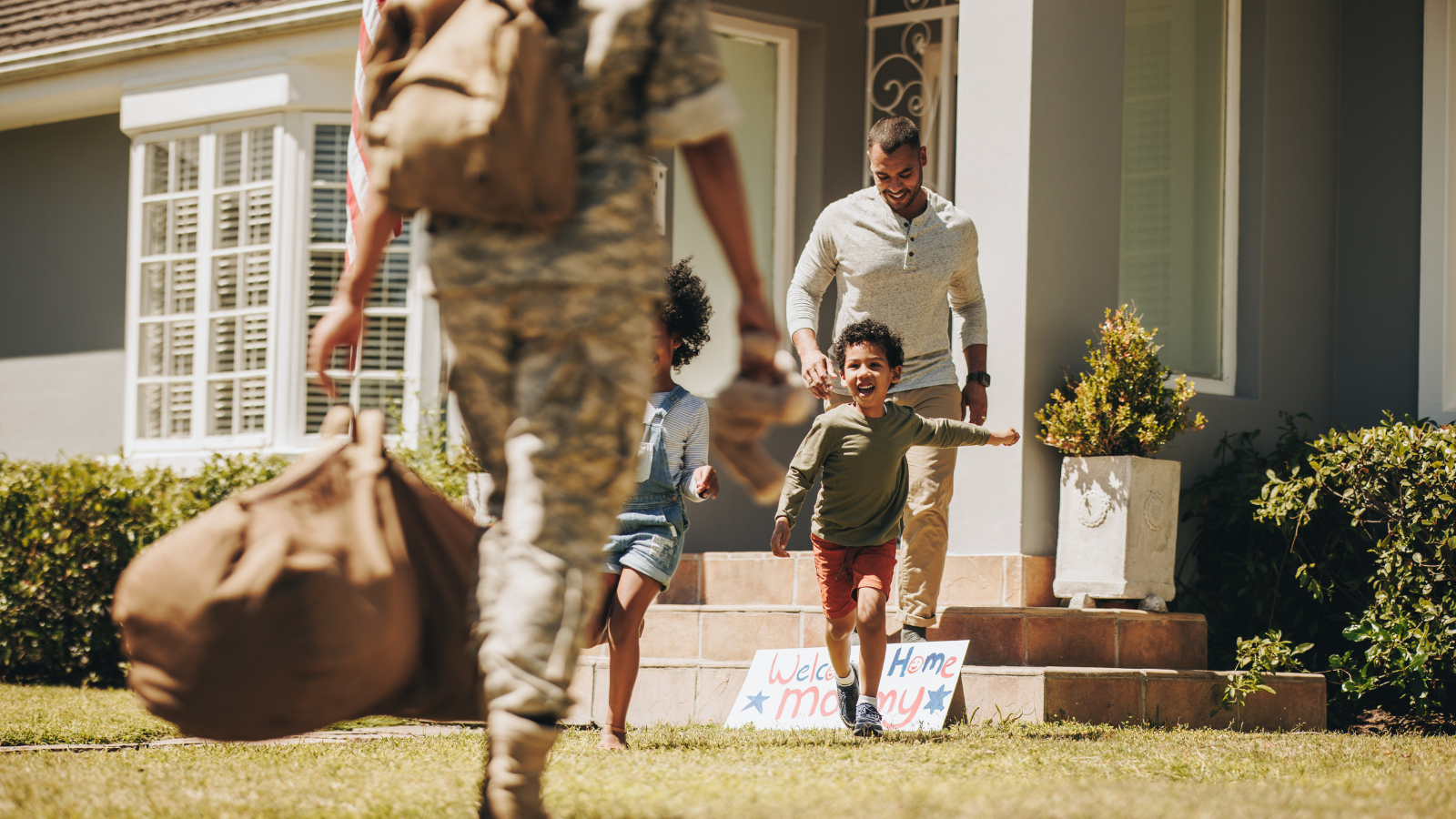 a mom returning home to husband and two children from active duty